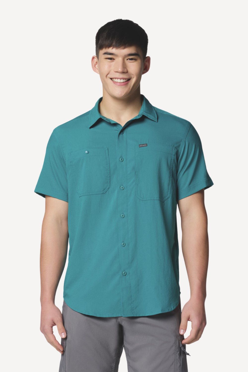 Chemise anti-UV turquoise pour homme, légère et respirante, offrant une protection solaire UPF50+.