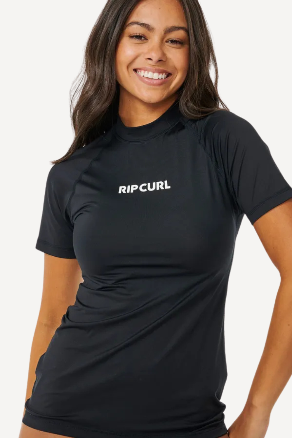 T-shirt de bain femme en lycra noir anti-UV UPF50+ de Rip Curl, idéal pour la protection solaire estivale.